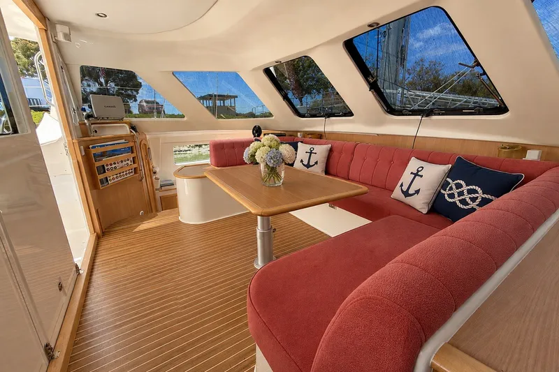 Slide: The Image of Main salon looking to port with Garmin GPS Chart Plotter stowed on swing arm mount - 19