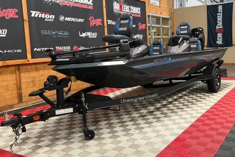 Slide: The Image of 2024 Ranger RT188P fishing boat on display with trailer in showroom. - 3