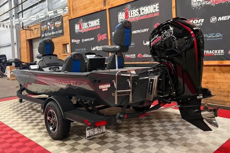 Slide: The Image of 2024 Ranger RT188P fishing boat with powerful outboard motor in showroom display. - 5