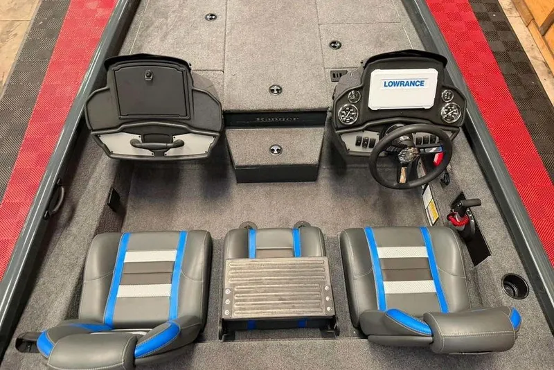 Slide: The Image of 2024 Ranger RT188P boat interior with dual seats, steering console, and Lowrance electronics. - 6