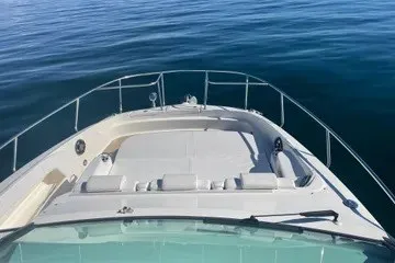 Slide: The Image of 2020 Sea Ray Sundancer 320 boat deck on calm blue water. - 15