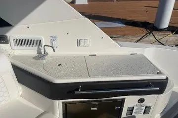 Slide: The Image of 2020 Sea Ray Sundancer 320 yacht kitchenette with sink and countertop. - 7