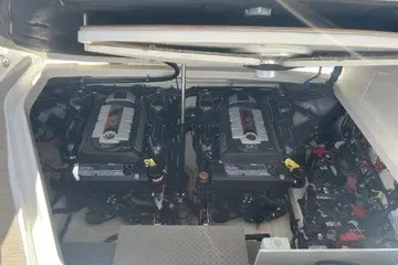 Slide: The Image of 2020 Sea Ray Sundancer 320 engine compartment with dual engines visible. - 12