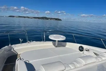 Slide: The Image of 2020 Sea Ray Sundancer 320 boat deck with ocean view and distant island. - 16