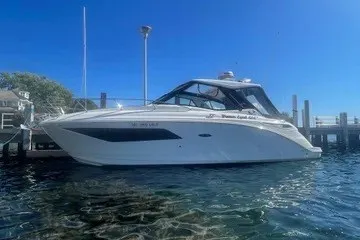 Slide: The Image of 2020 Sea Ray Sundancer 320 yacht docked in sunny marina. - 1