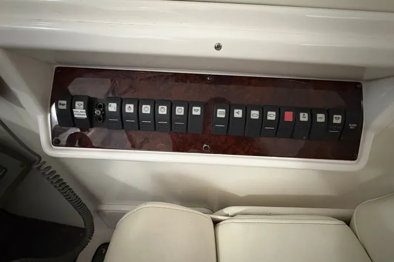Slide: The Image of Control panel of a 2007 Regal Commodore 3760 IO boat with labeled switches. - 15