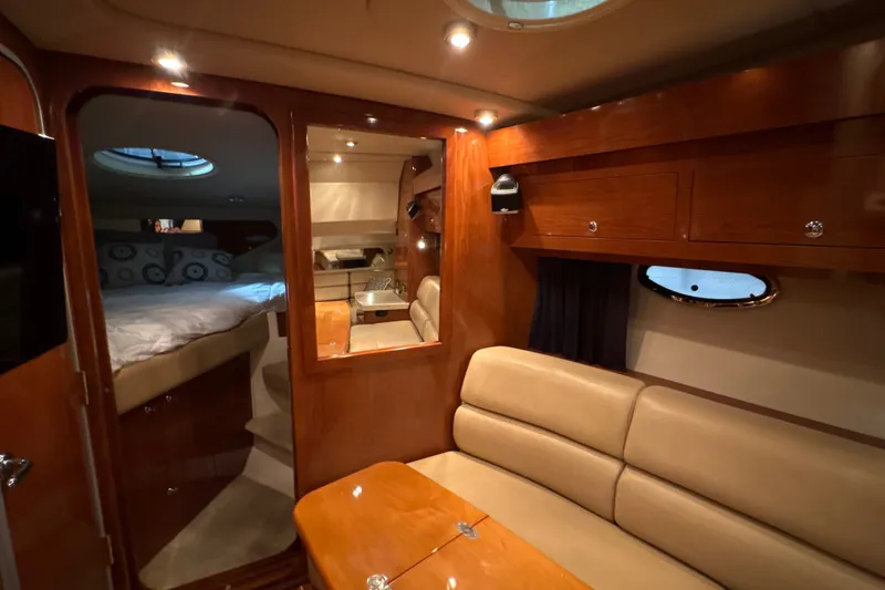 Slide: The Image of Luxurious interior of 2007 Regal Commodore 3760 IO yacht with cozy seating and elegant wood finishes. - 23
