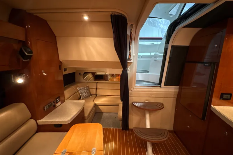 Slide: The Image of Luxurious interior of 2007 Regal Commodore 3760 IO yacht with seating and wooden accents. - 17