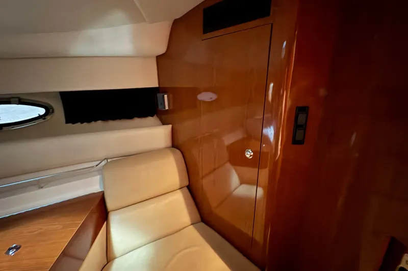 Slide: The Image of Interior of 2007 Regal Commodore 3760 IO yacht with wood paneling and seating. - 21