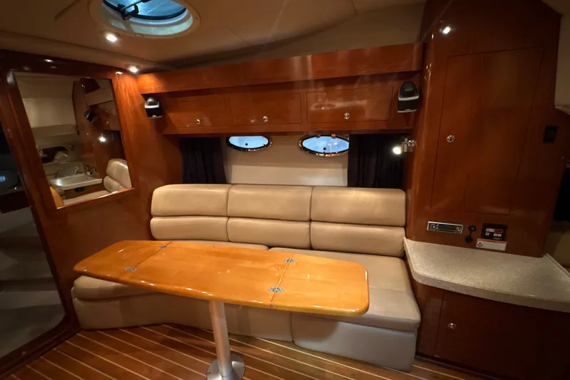 Slide: The Image of Luxurious interior of 2007 Regal Commodore 3760 IO yacht with wood finishes and plush seating. - 24