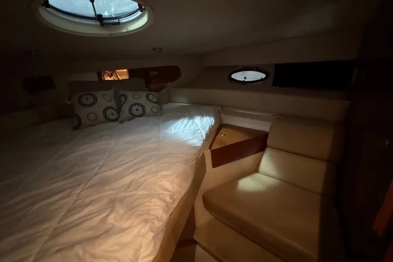 Slide: The Image of Interior cabin of 2007 Regal Commodore 3760 IO with bed and seating area. - 26