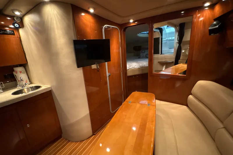 Slide: The Image of Luxurious interior of 2007 Regal Commodore 3760 IO yacht with wood finishes and modern amenities. - 20