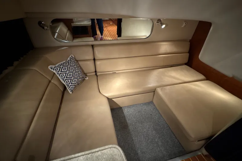 Slide: The Image of Interior of 2007 Regal Commodore 3760 IO yacht with beige seating and geometric pillow. - 19