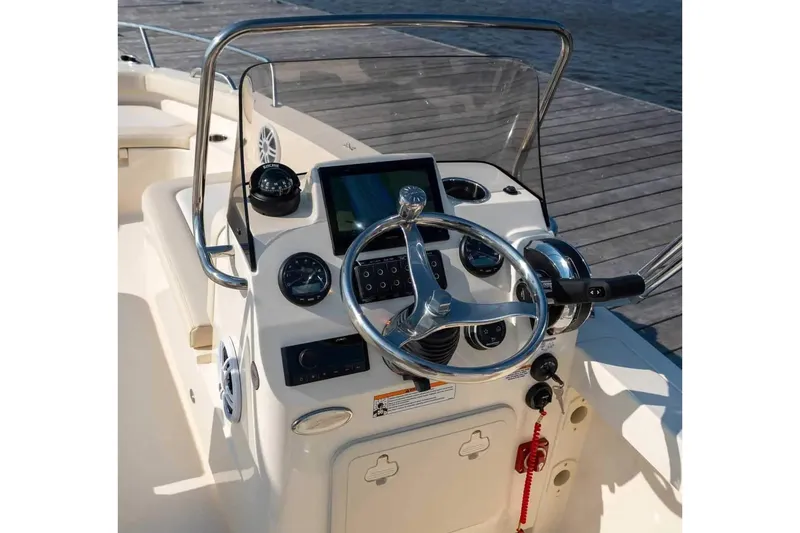 Slide: The Image of Manufacturer Provided Image: 2026 Scout 188 Sport Dorado boat dashboard with steering wheel and navigation controls. - 5