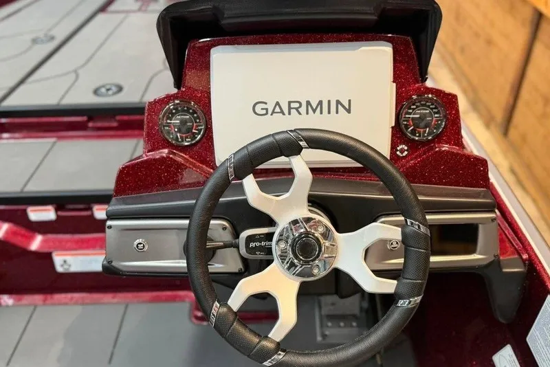 Slide: The Image of Steering wheel and Garmin display on 2026 Nitro Z20 XL Pro boat dashboard. - 12