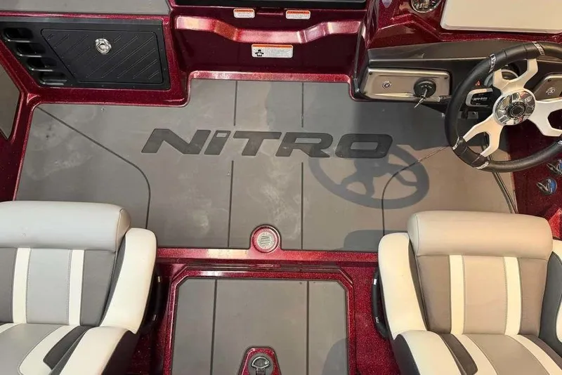 Slide: The Image of Interior of 2026 Nitro Z20 XL Pro boat with steering wheel and seating. - 8