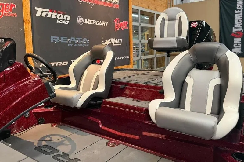 Slide: The Image of 2026 Nitro Z20 XL Pro boat interior with stylish seating and steering wheel. - 11
