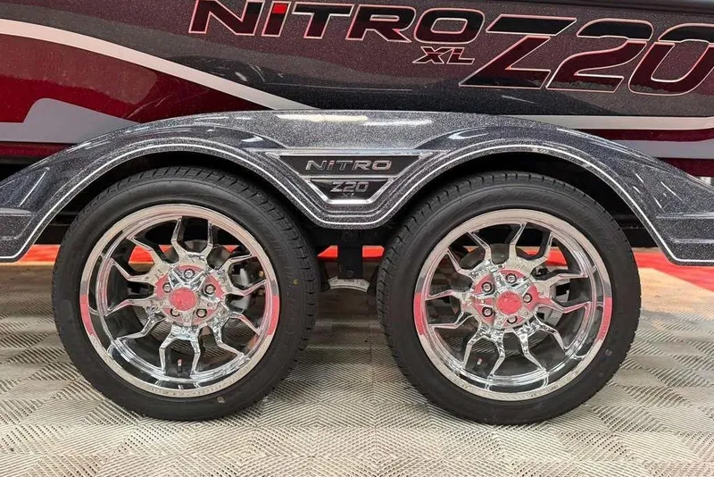 Slide: The Image of 2026 Nitro Z20 XL Pro trailer with shiny chrome wheels and detailed fender design. - 4