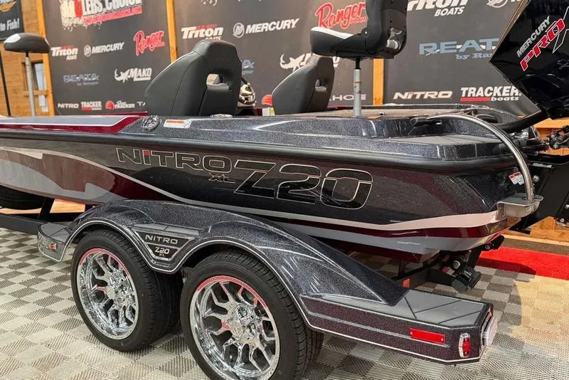 Slide: The Image of 2026 Nitro Z20 XL Pro boat with sleek design and dual axle trailer. - 5