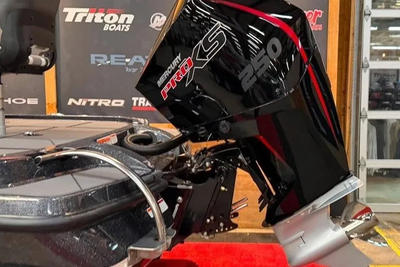 Slide: The Image of 2026 Nitro Z20 XL Pro boat with Mercury Pro XS 250 engine displayed indoors. - 2