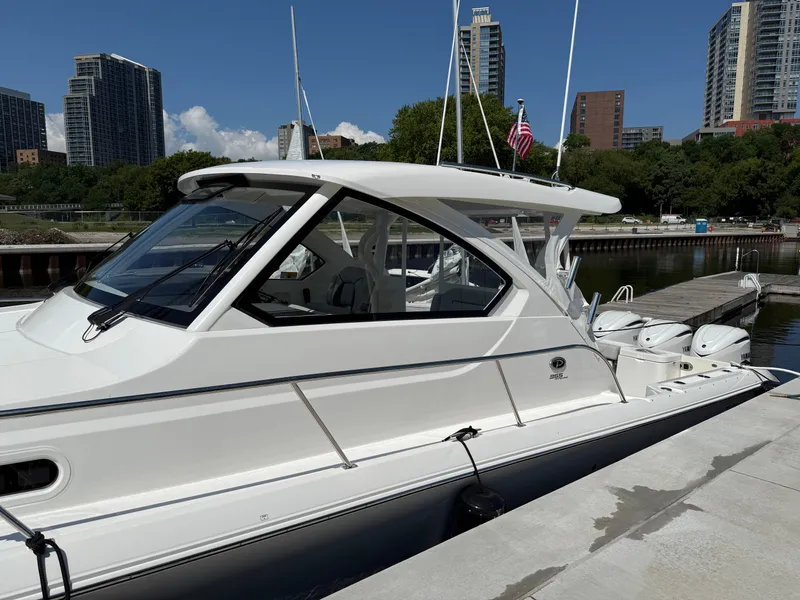 Slide: The Image of A sleek, modern boat docked against an urban skyline backdrop. - 3
