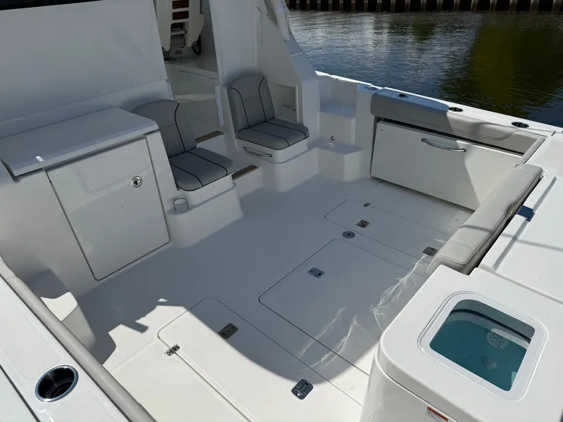 Slide: The Image of The 2027 Pursuit OS 355 Offshore cockpit is spacious with seating and storage areas. - 8