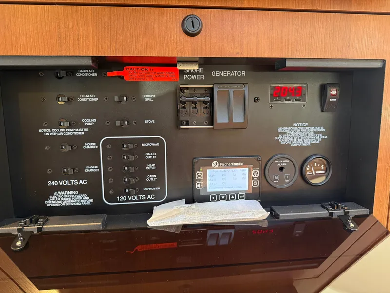 Slide: The Image of The image shows an electrical control panel with various switches and displays. - 31