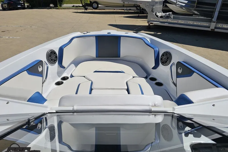 Slide: The Image of 2022 Scarab 255 Wake ID boat interior with blue and white seating and cup holders. - 83