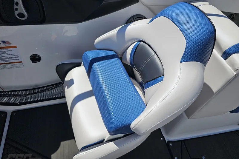 Slide: The Image of Blue and white seating on 2022 Scarab 255 Wake ID boat interior. - 70