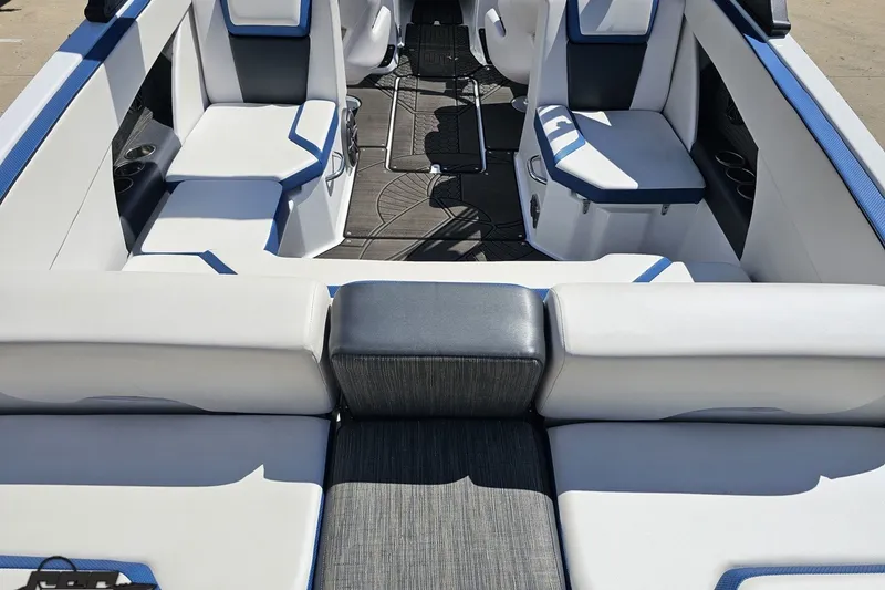 Slide: The Image of 2022 Scarab 255 Wake ID boat interior with white and blue seating. - 39