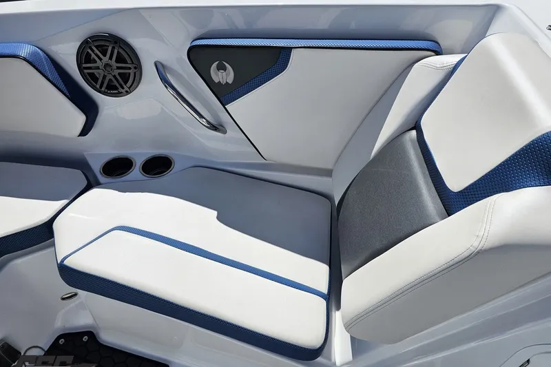 Slide: The Image of Interior seating of 2022 Scarab 255 Wake ID boat with blue and white upholstery. - 93
