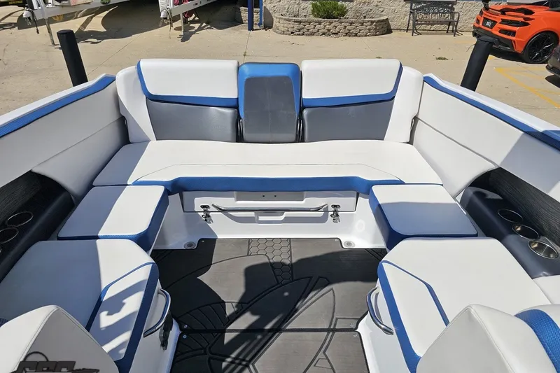 Slide: The Image of 2022 Scarab 255 Wake ID boat interior with white and blue seating. - 105