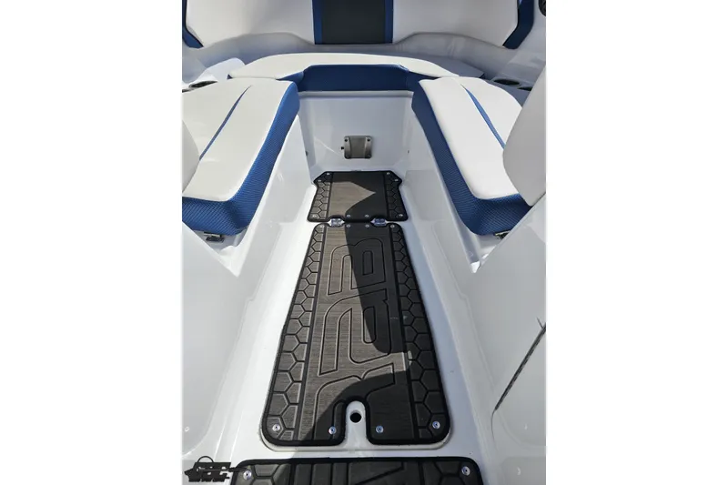 Slide: The Image of Interior of 2022 Scarab 255 Wake ID boat with blue and white seating. - 100