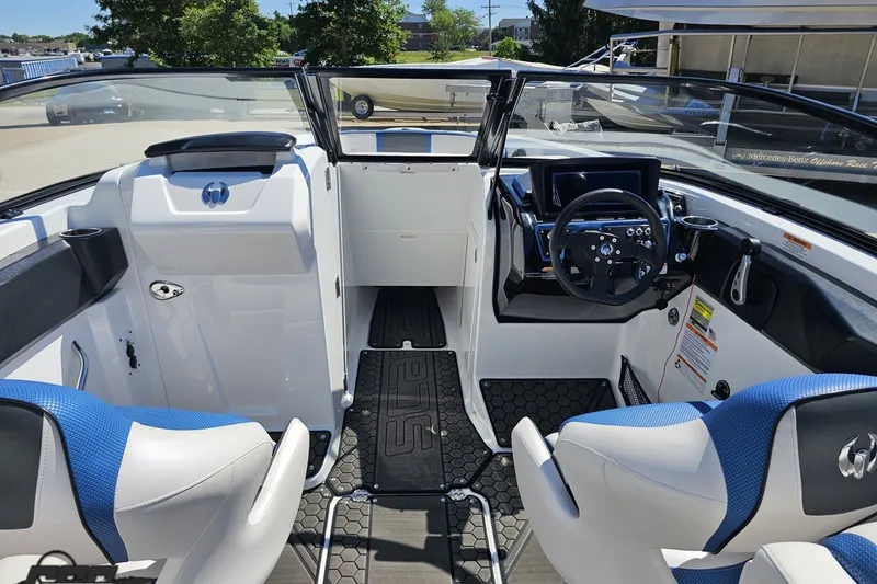 Slide: The Image of Interior view of 2022 Scarab 255 Wake ID boat, featuring modern dashboard and seating. - 60
