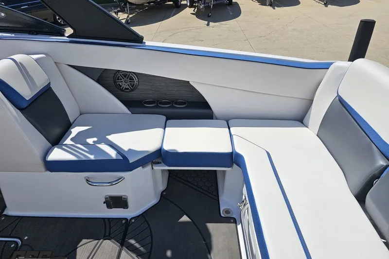 Slide: The Image of 2022 Scarab 255 Wake ID boat interior with white and blue seating. - 44