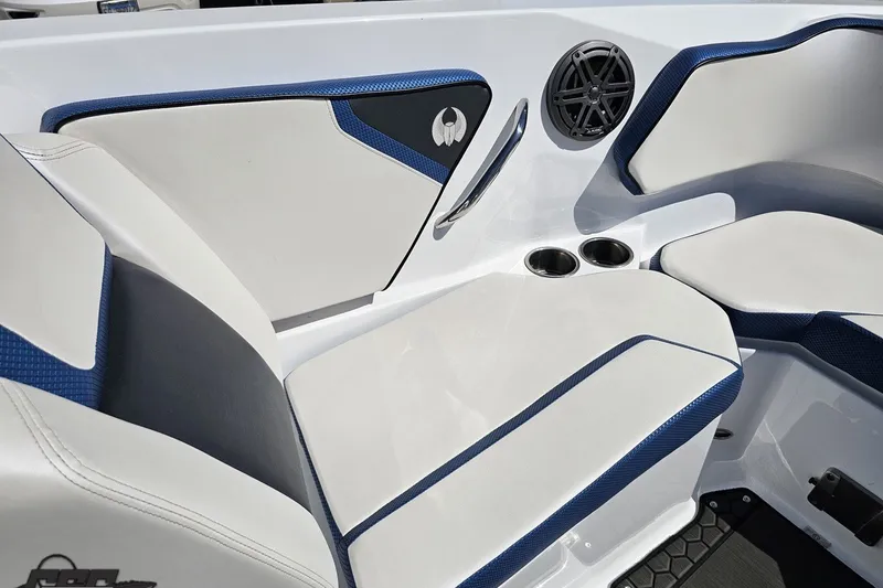 Slide: The Image of Interior seating of 2022 Scarab 255 Wake ID boat with blue and white upholstery. - 94