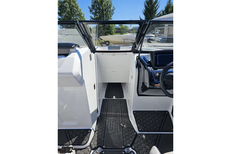 Slide: The Image of 2022 Scarab 255 Wake ID boat interior with modern dashboard and flooring. - 79