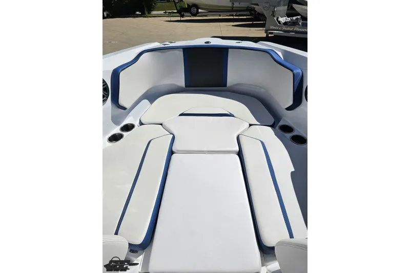 Slide: The Image of 2022 Scarab 255 Wake ID boat interior with white and blue seating. - 88