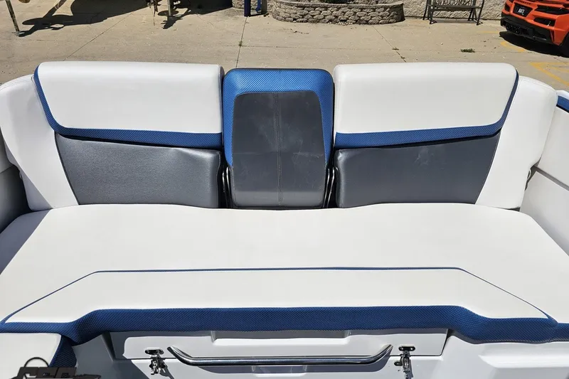 Slide: The Image of 2022 Scarab 255 Wake ID boat interior with white and blue seating. - 111
