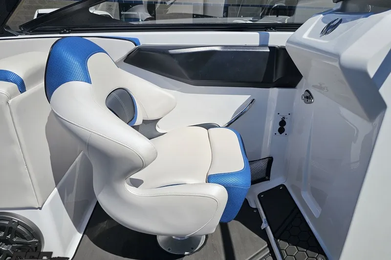 Slide: The Image of Interior of 2022 Scarab 255 Wake ID boat with blue and white seating. - 63