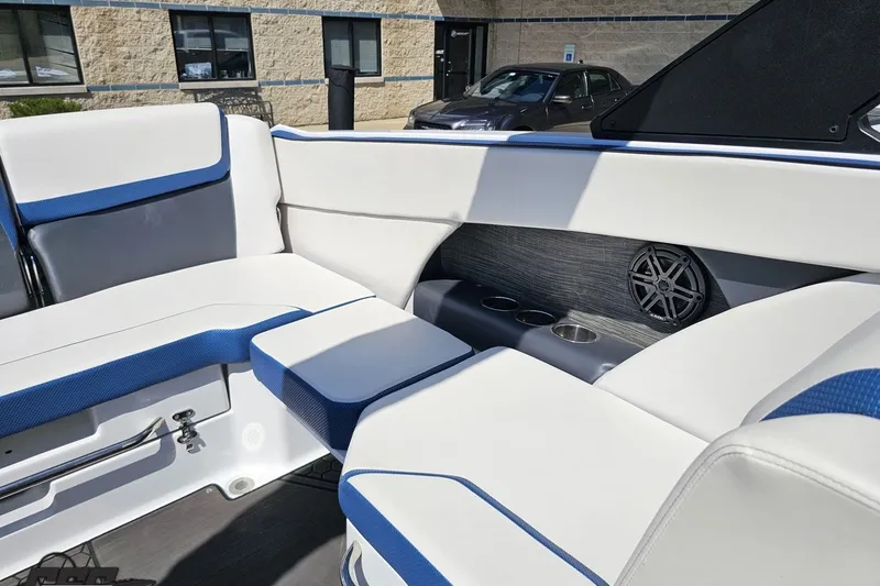 Slide: The Image of Interior of 2022 Scarab 255 Wake ID boat with blue and white seating. - 109
