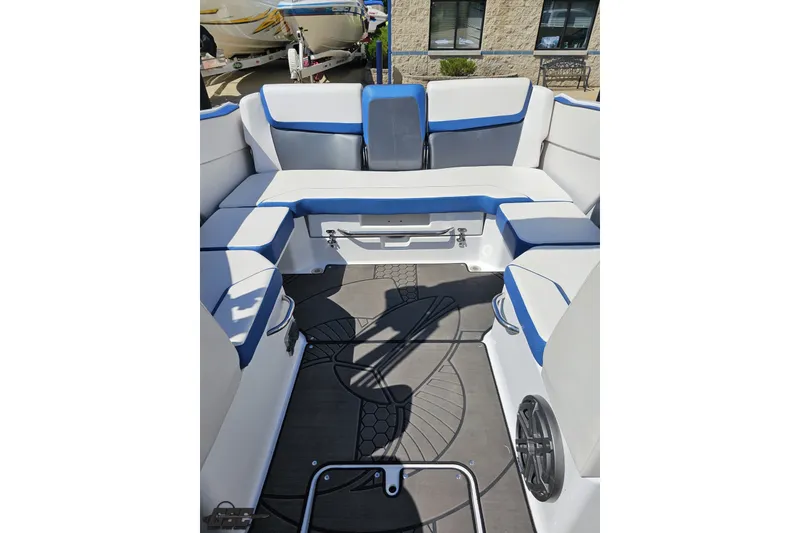 Slide: The Image of Interior of 2022 Scarab 255 Wake ID boat with white and blue seating. - 106