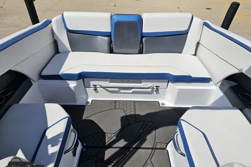 Slide: The Image of 2022 Scarab 255 Wake ID boat interior with white and blue seating arrangement. - 112