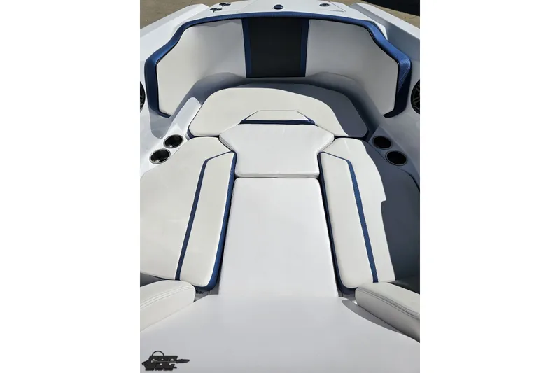 Slide: The Image of 2022 Scarab 255 Wake ID boat interior with white and blue cushioned seating. - 85