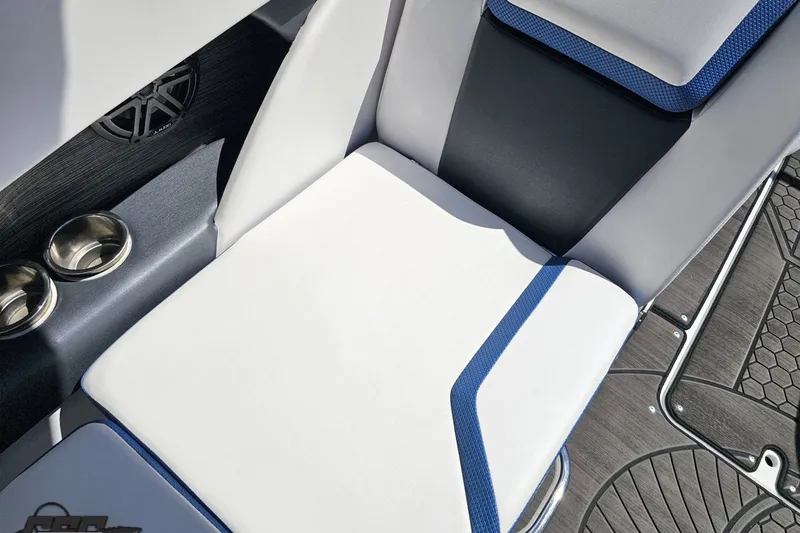 Slide: The Image of 2022 Scarab 255 Wake ID boat interior with white and blue seating, cup holders, and speaker. - 53