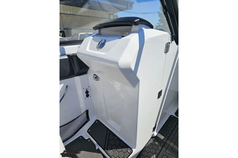Slide: The Image of 2022 Scarab 255 Wake ID boat interior, featuring sleek white console design and modern controls. - 65