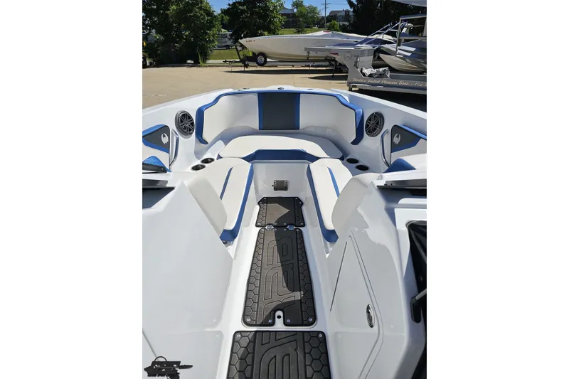 Slide: The Image of 2022 Scarab 255 Wake ID boat interior with blue accents and seating. - 90