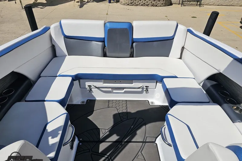 Slide: The Image of Interior of 2022 Scarab 255 Wake ID boat with white and blue seating. - 107