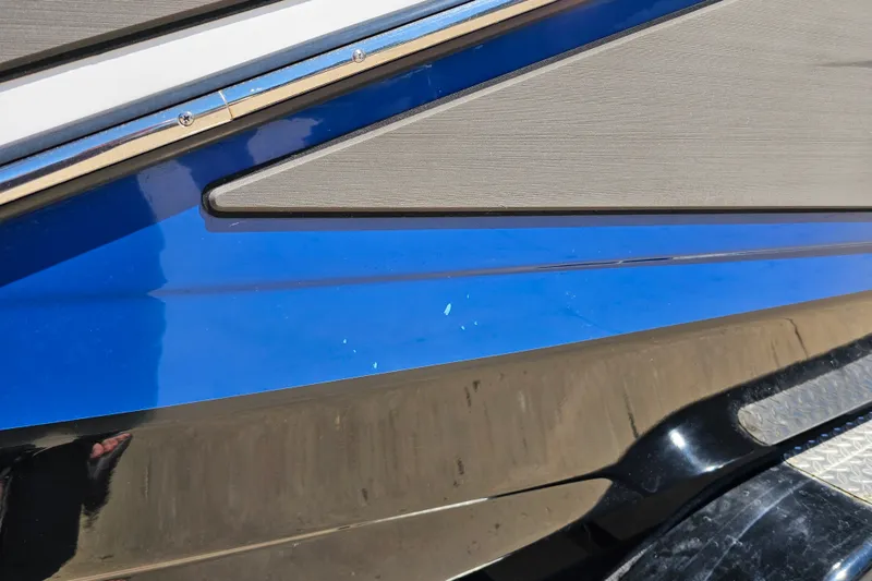 Slide: The Image of 2022 Scarab 255 Wake ID boat hull with blue and black detailing. - 122