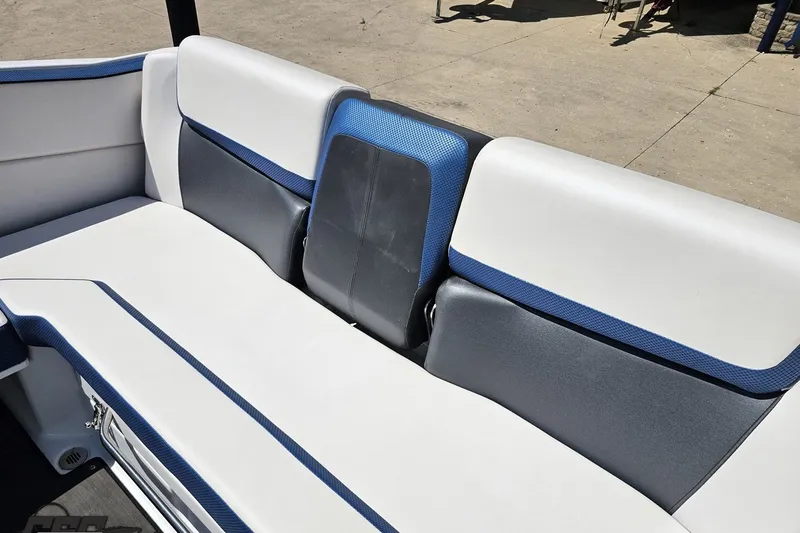 Slide: The Image of 2022 Scarab 255 Wake ID boat interior with white and blue seating. - 43